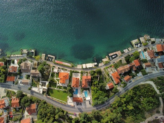 Drone view of Kotor residential coast.